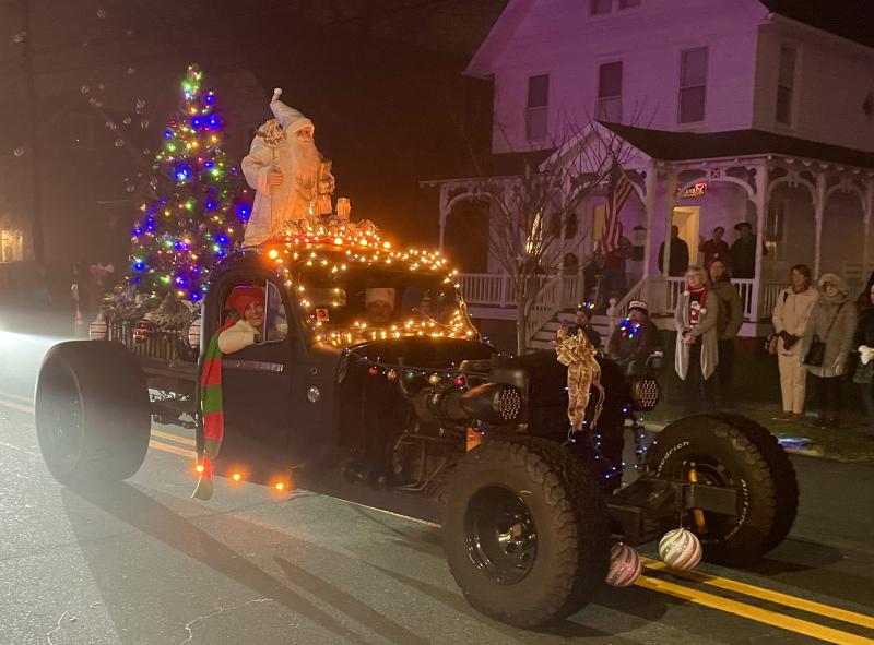 Father Christmas rides atop a 1937 Rat Rod owned by Paul Magliato of Sand and Sunset Getaway.